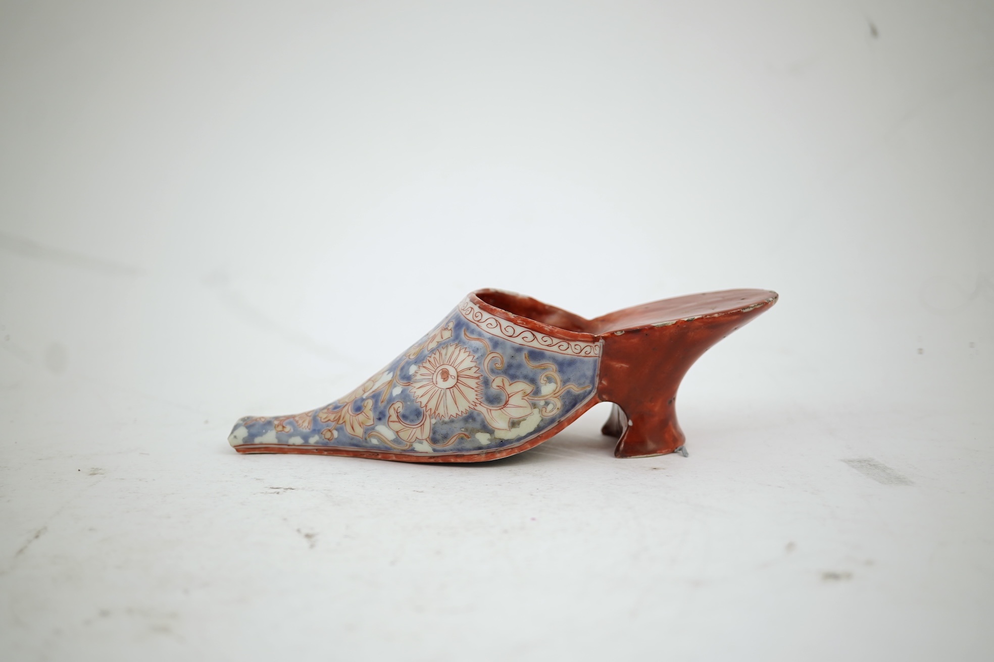 A rare Japanese Arita or Chinese porcelain model of a shoe, based on a Delft shape, first half of 18th century